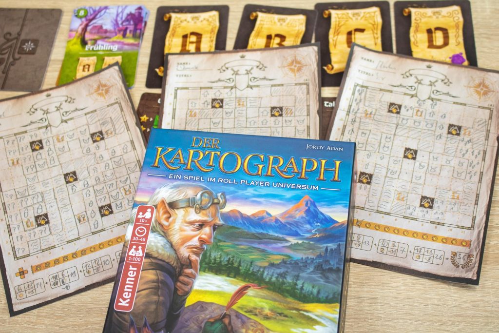 Spielblätter und Karten des Brettspiels Der Kartograph